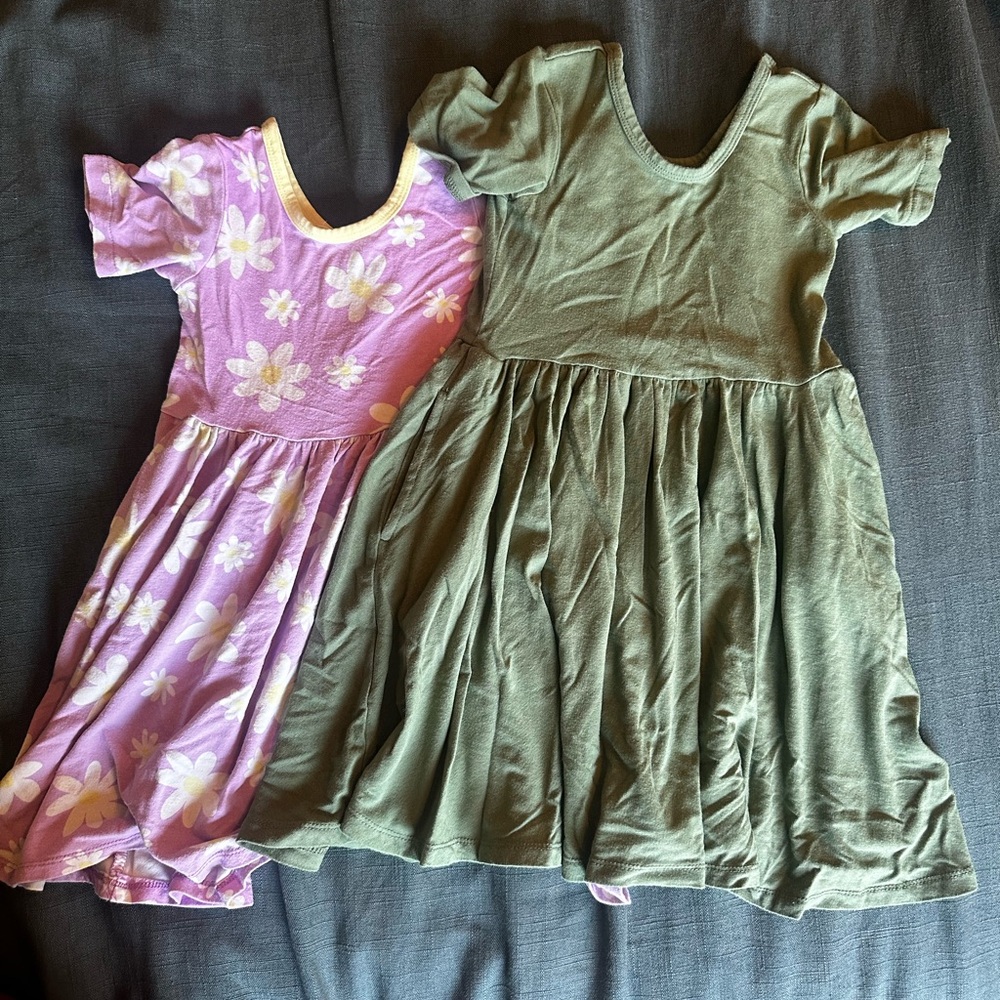Lark Adventure Wear. Pink flower print and solid green short sleeved dresses